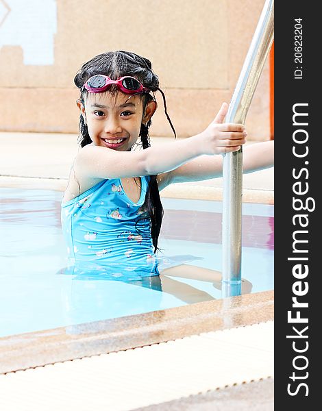 Young girl going out of swimming pool