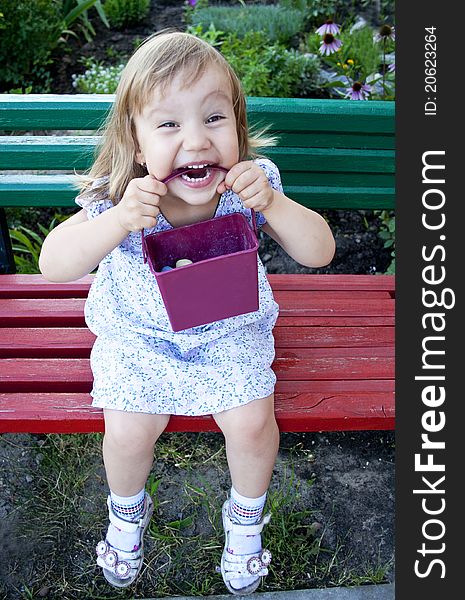 Portrait of blonde little girl outdoors