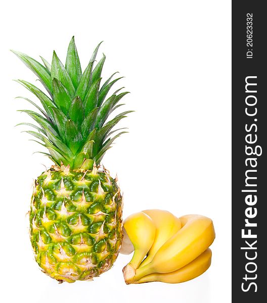 Ripe pineapple, bunch of bananas on a white background. Ripe pineapple, bunch of bananas on a white background