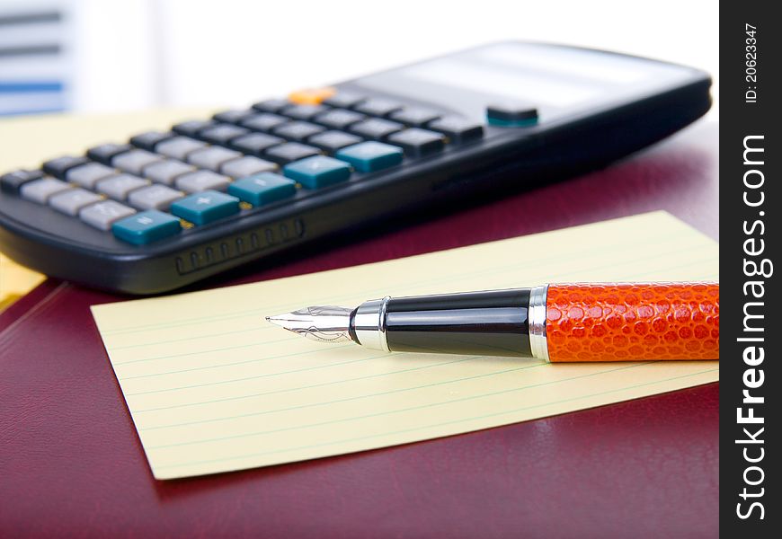 Notebook, pen and calculator