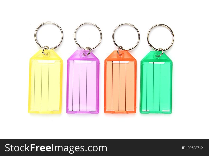 Colorful keyring tags on a white background