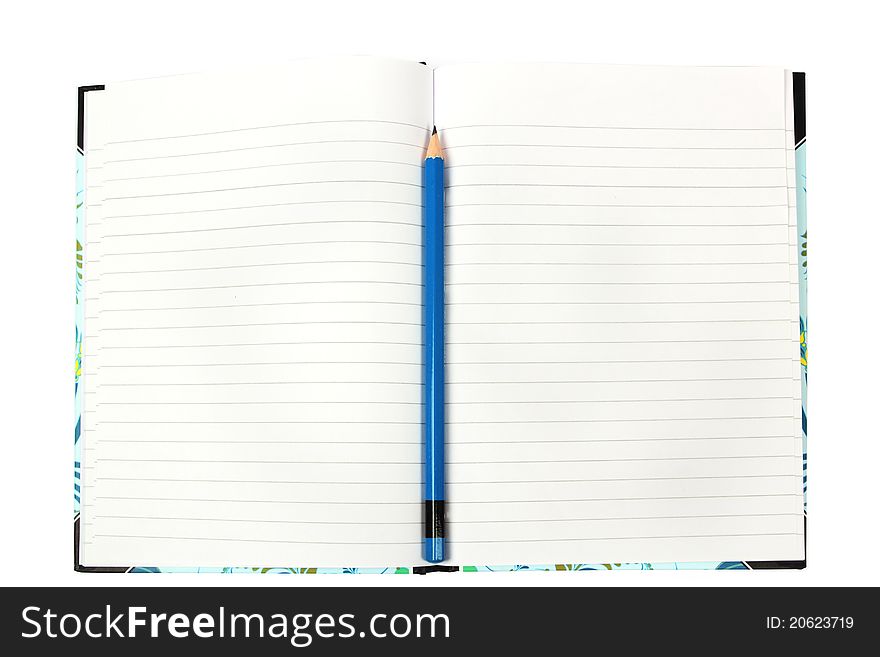 Single blue pencil in the center of a writing book. Single blue pencil in the center of a writing book