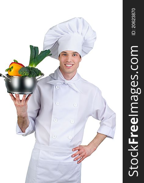 Young cook with vegetables in pan. Young cook with vegetables in pan