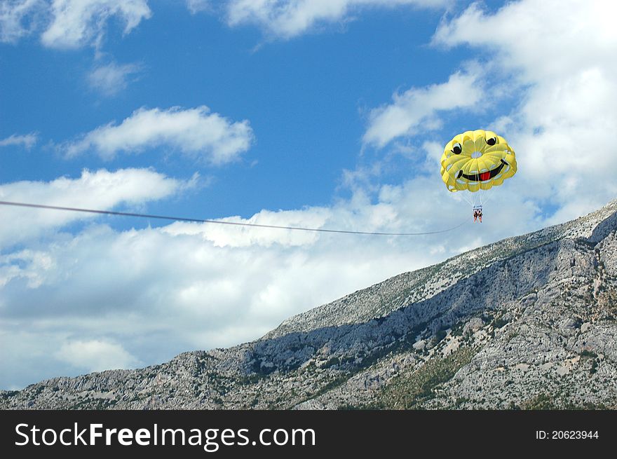 Breathtaking view of two beautiful girls during parasailing