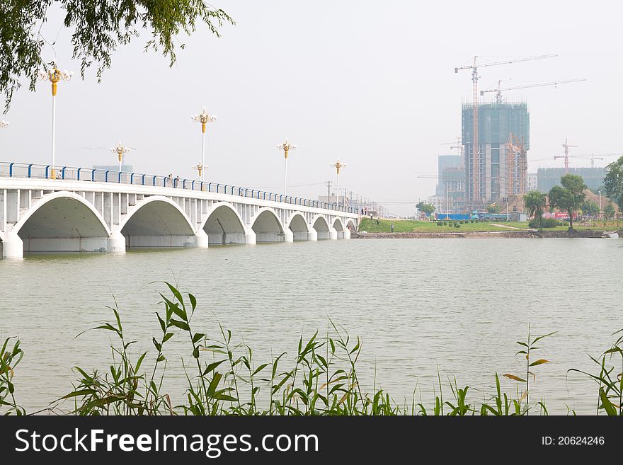 A bridge across the river in a park