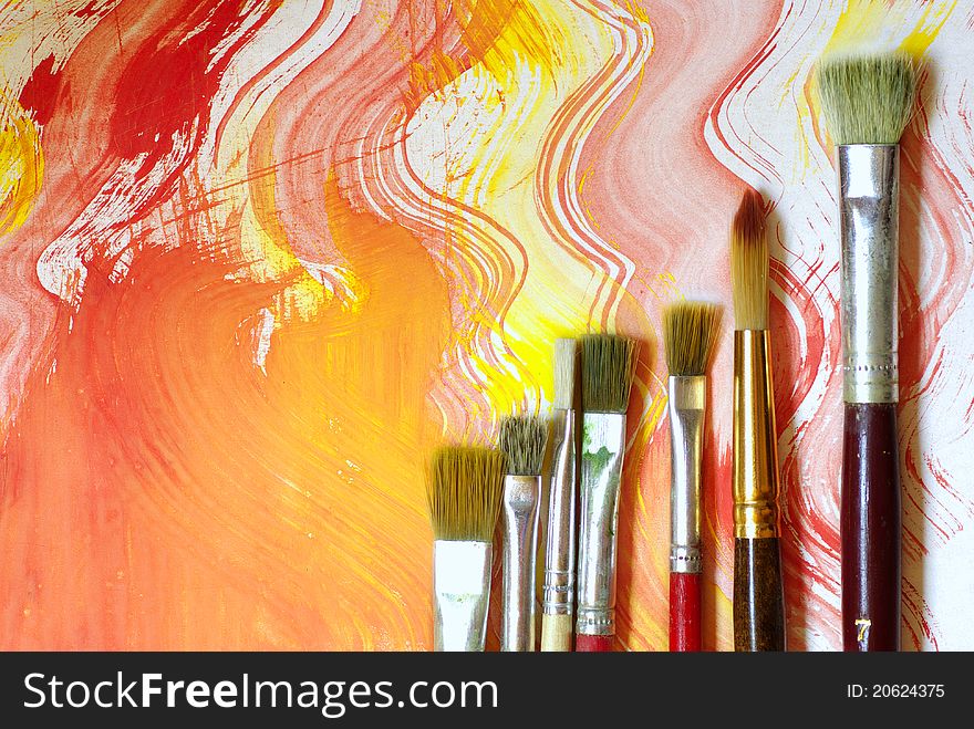 Abstract background, paint and brushes