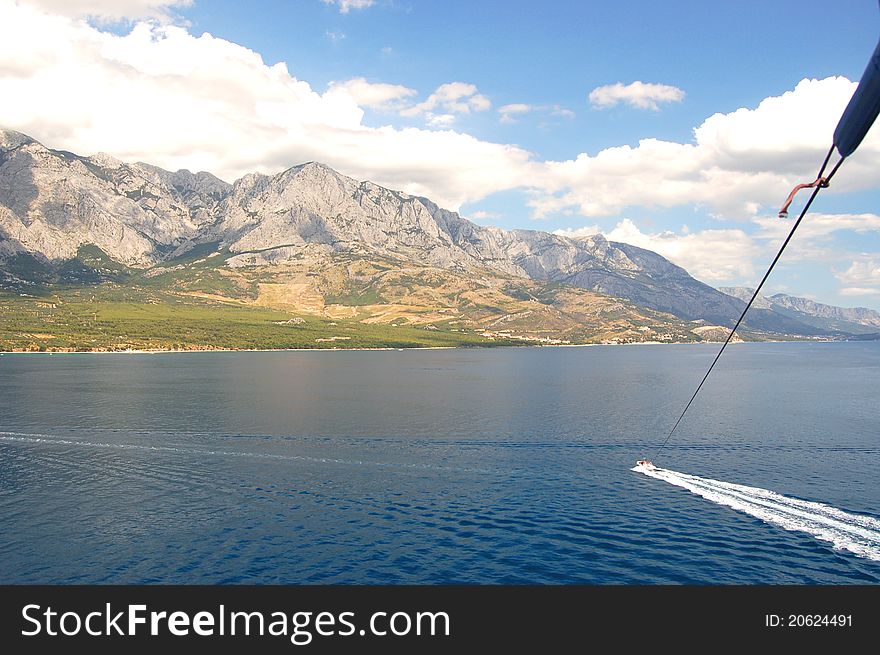 Parasailing on dalmatian coast in Baska Voda in Croatia