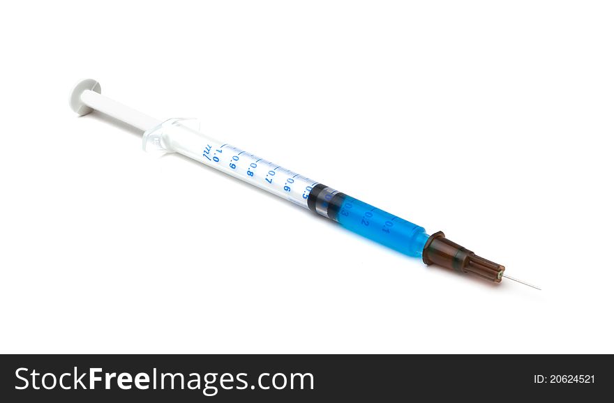 Syringe on white background with blue liquid: