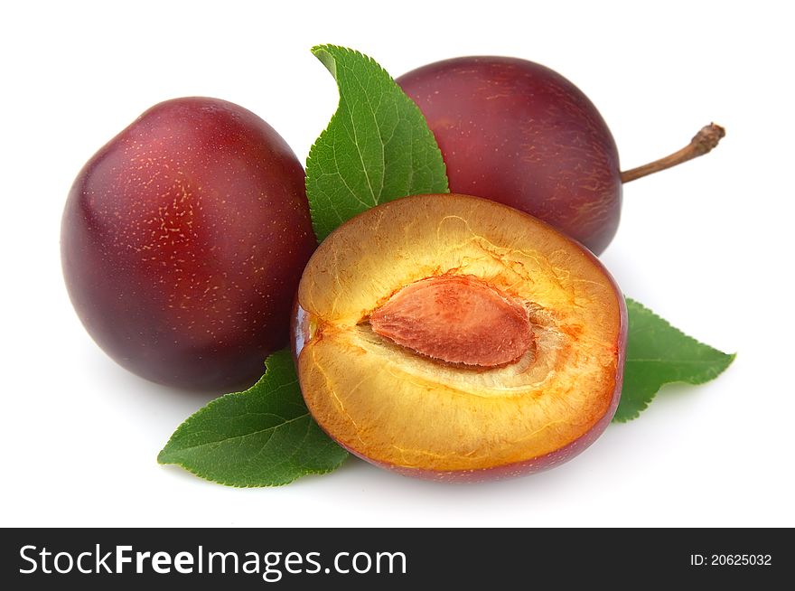 Sweet plums with leafs close up