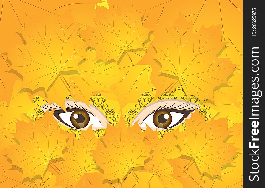 Eyes of autumn are in a mask and leaves