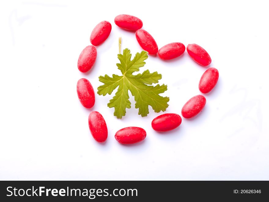 Red drugs form hearth, the green leave is of Geranium. Red drugs form hearth, the green leave is of Geranium