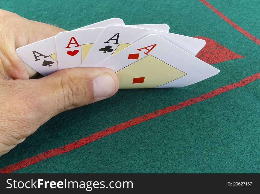 Poker player with four aces poker hand