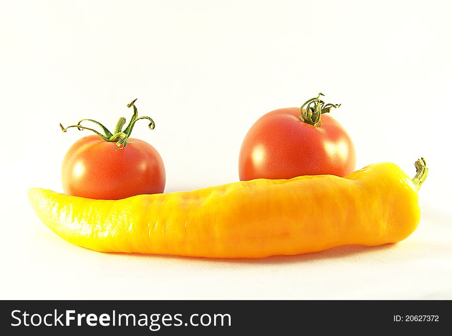 Red Tomatos And Yellow Pepper