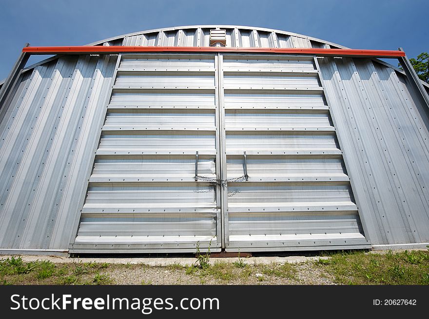 Wide angle abstract closeup image of a huge steel warehouse. Wide angle abstract closeup image of a huge steel warehouse.