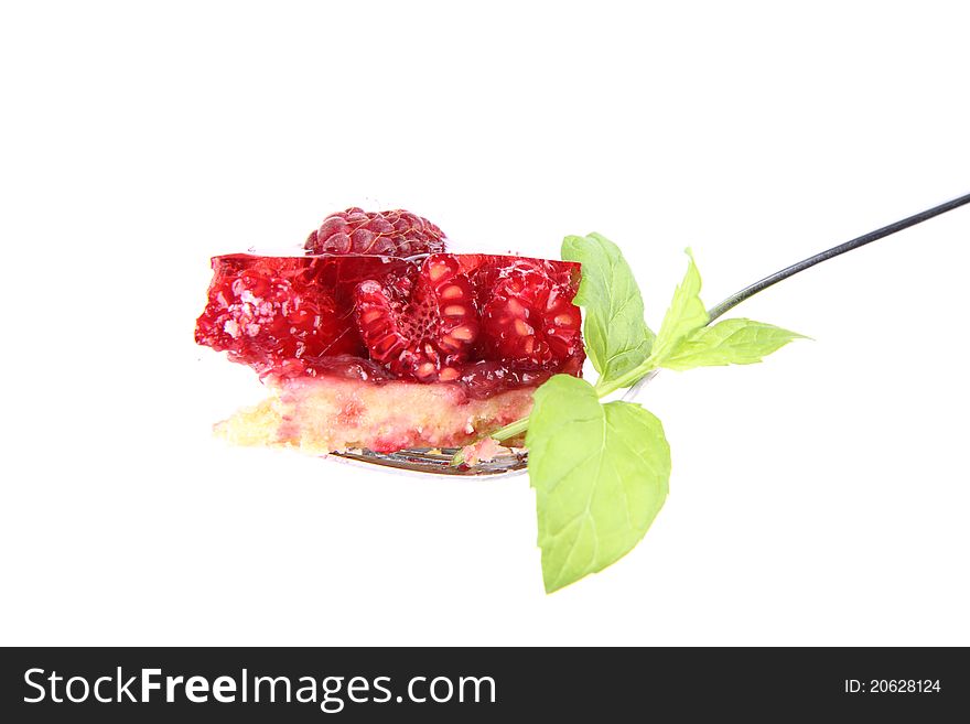 Raspberry Tart - a bite on a fork decorated with mint