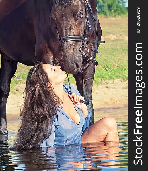 Kiss of pretty girl to yours horse outdoor sunny evening. Kiss of pretty girl to yours horse outdoor sunny evening