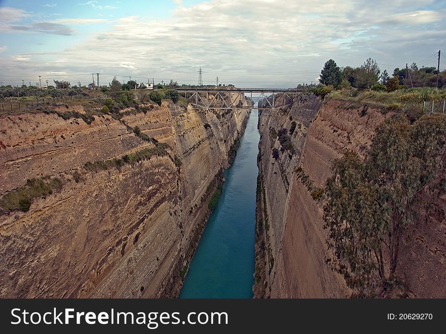 A canal that connects the Gulf of Corinth with the Saronic Gulf in the Aegean Sea. A canal that connects the Gulf of Corinth with the Saronic Gulf in the Aegean Sea.