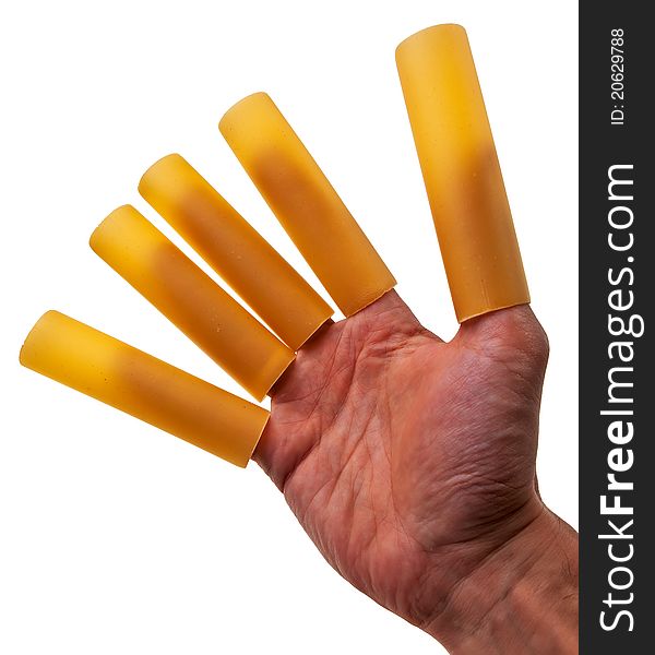 Male hand with cannelloni pasta tubes nailed on fingers over white background. Male hand with cannelloni pasta tubes nailed on fingers over white background.