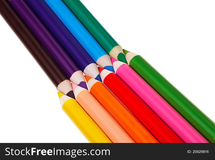 Colorful wooden crayons isolated over white background. Colorful wooden crayons isolated over white background.