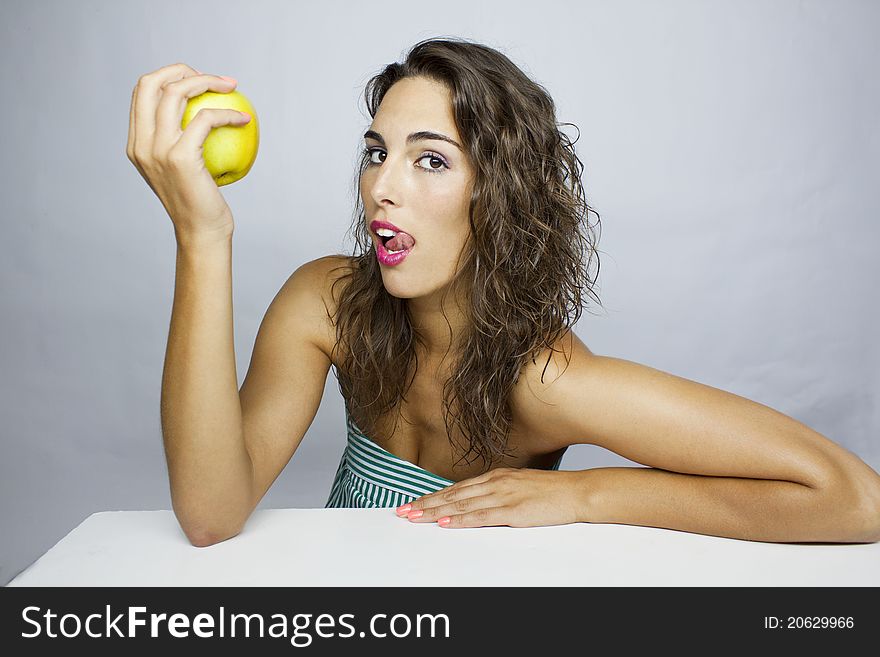 Girl eating a green apple. Girl eating a green apple