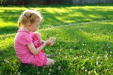 Young Girl In Pink Picking Up Flowers In A Field Stock Images Young Girl In Pink Picking Up Flowers In A Field Stock Images