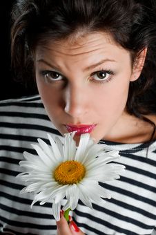 Beautiful Young Woman With Chamomile In Hand Stock Photography