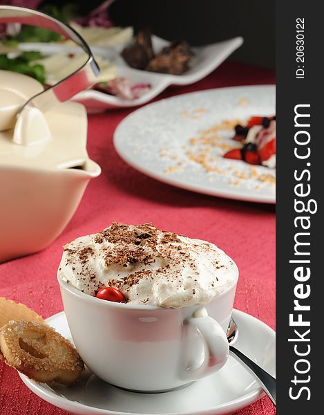 Cappuccino with cream and chocolate flakes