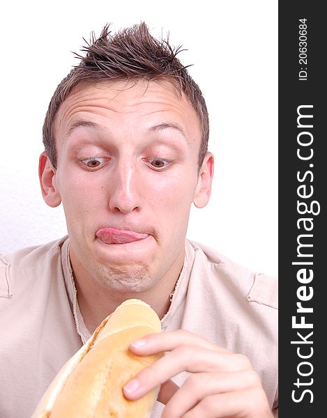 Portrait of a young man preparing to eat his sandwich