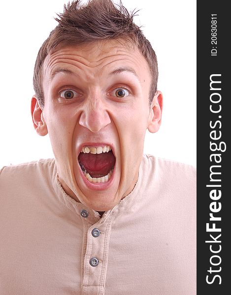 Portrait of a young manscreaming into the camera, isolated on white. Portrait of a young manscreaming into the camera, isolated on white