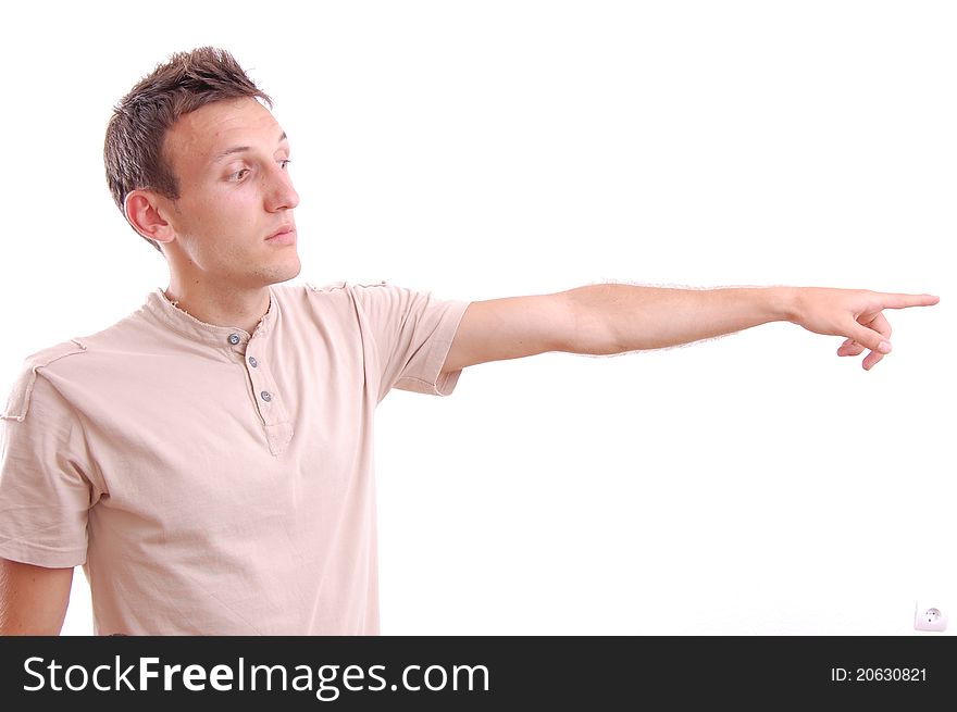 Portrait of a casual young man pointing his finger at something, isolated on white. Portrait of a casual young man pointing his finger at something, isolated on white