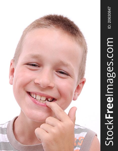 Portrait of a smiling boy showing his missing tooth, isolated on white. Portrait of a smiling boy showing his missing tooth, isolated on white