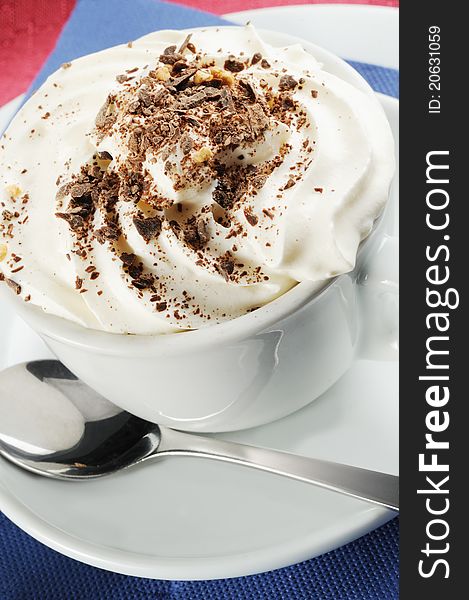 Cappuccino with cream and chocolate flakes