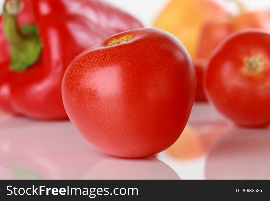 Tomatoes, vegetables on the background. Tomatoes, vegetables on the background.