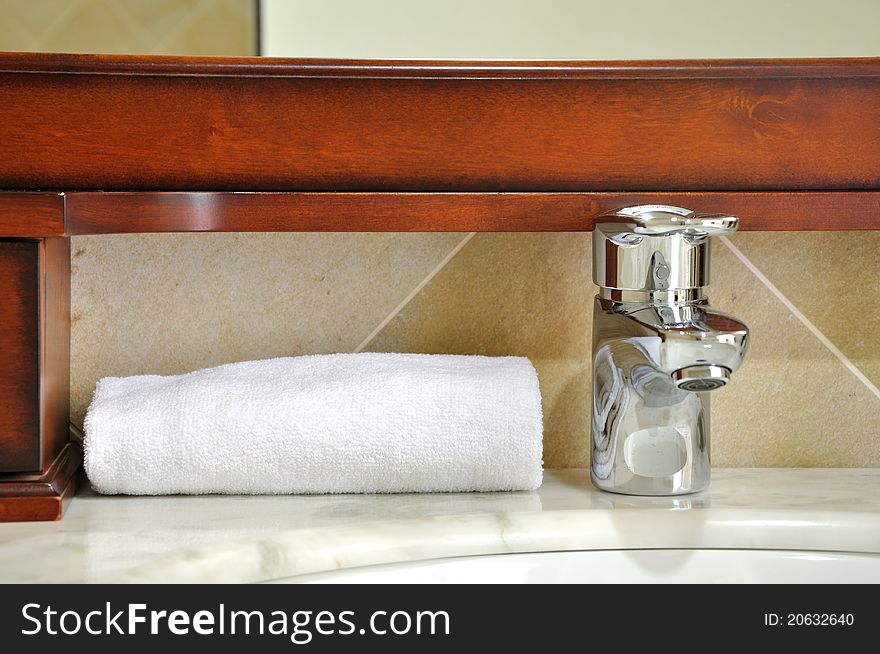 Washroom things detail, towel and water tap, shown as using and setting in house, and comfortable life style. Washroom things detail, towel and water tap, shown as using and setting in house, and comfortable life style.