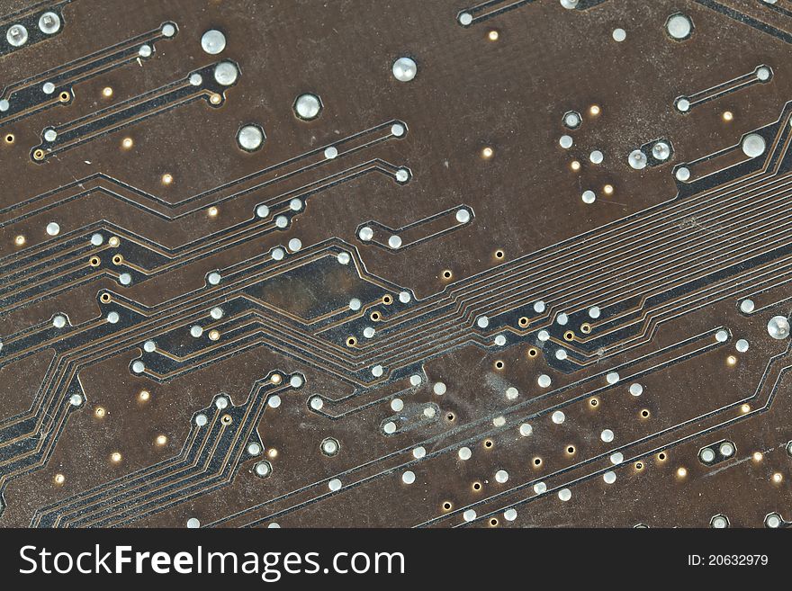 The printed-circuit board with electronic components macro background. The printed-circuit board with electronic components macro background