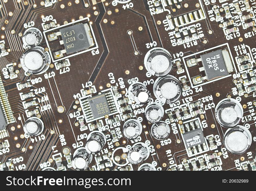 The printed-circuit board with electronic components macro background. The printed-circuit board with electronic components macro background