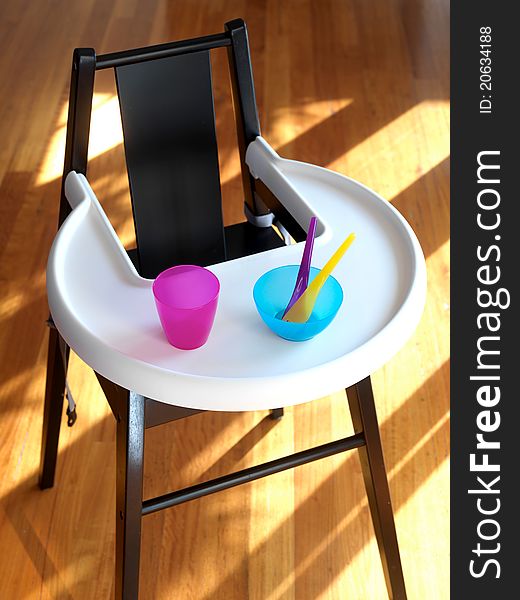 An infants highchair in a modern kitchen