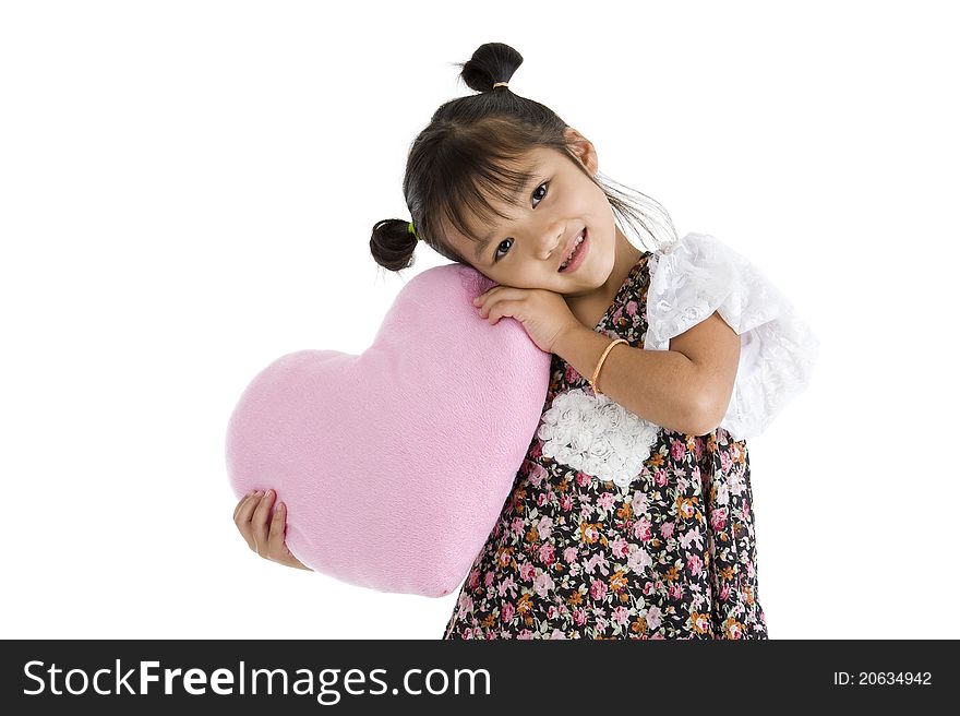 Girl with heart shaped pillow