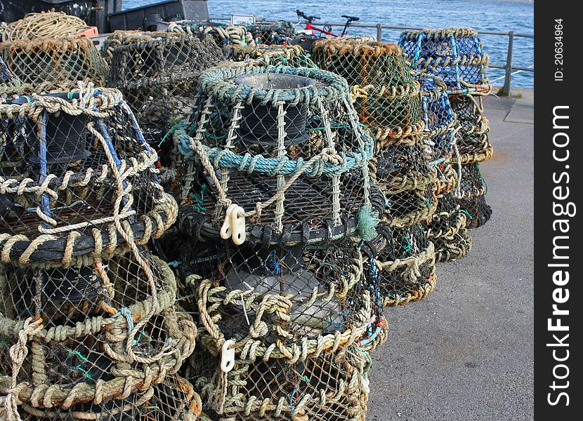 Stacks of lobster and crab pots on the harbourside. Stacks of lobster and crab pots on the harbourside