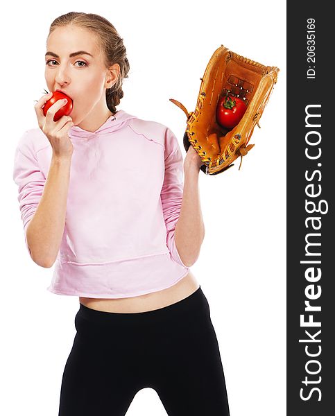 Young woman holding a tomato in baseball glove