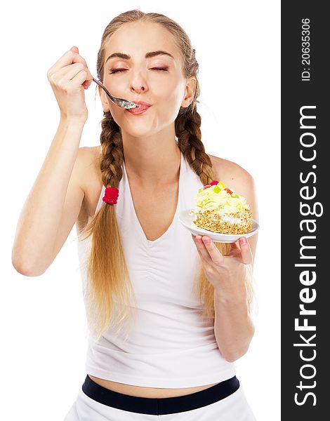 Young lady tasting a cake, studio portrait. Young lady tasting a cake, studio portrait
