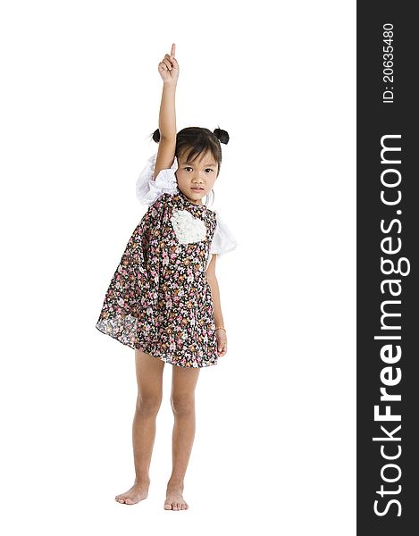 Little girl pointing up, isolated on white background