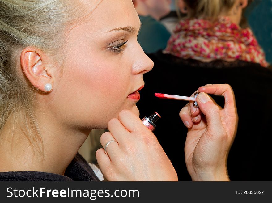 Young woman getting a make-up. Young woman getting a make-up