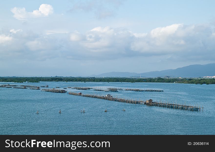 Fish farm in the sea before sunset,countryside Thailand