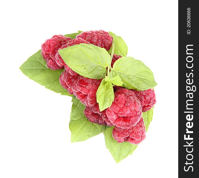 Raspberries: a stack of fruit decorated with mint leaves on white background