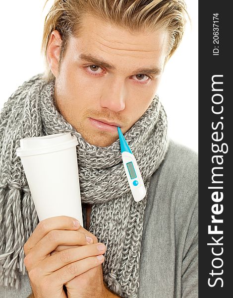 Blond man holding thermometer and cup. Blond man holding thermometer and cup