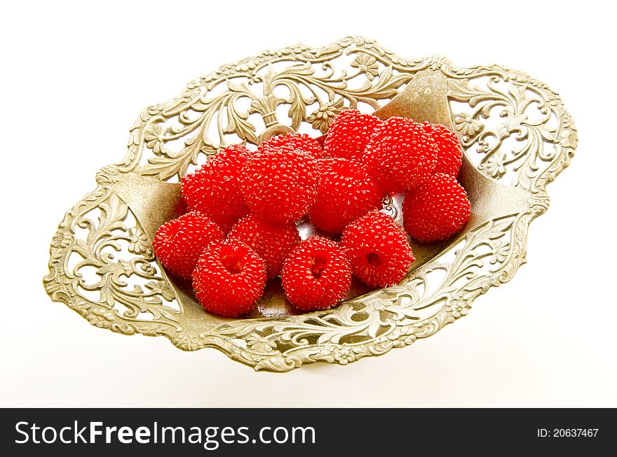 Red raspberry in the vintage metal vase. Red raspberry in the vintage metal vase