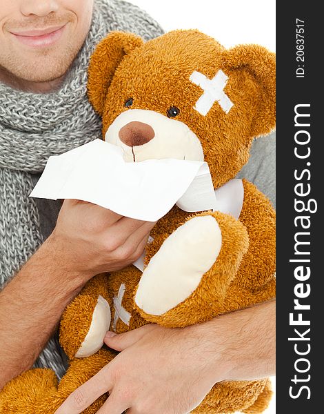 Man holding a bear and tissue. Man holding a bear and tissue