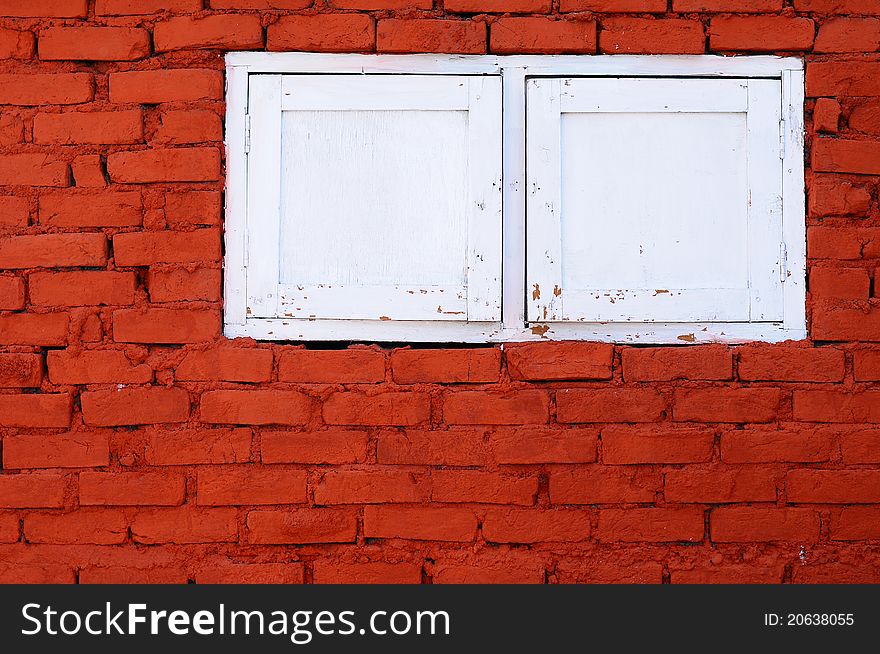 The white windows and brick walls. The white windows and brick walls