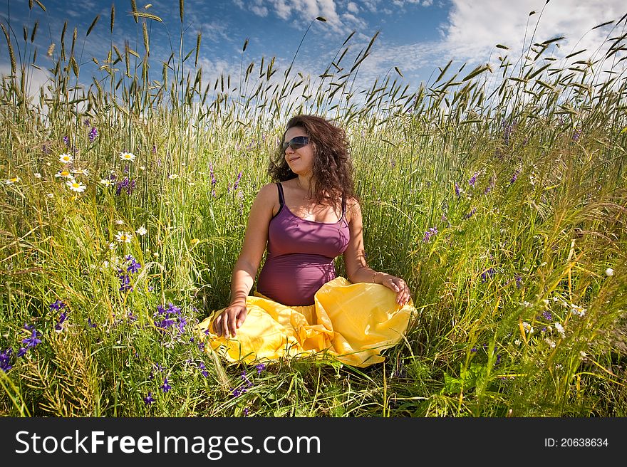 Pregnant Woman On Green Grass Field Under Blue Sky